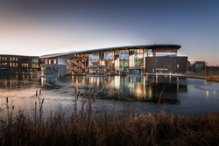 A view from across the lake looking towards The Ron Cooke Hub on Campus East in winter